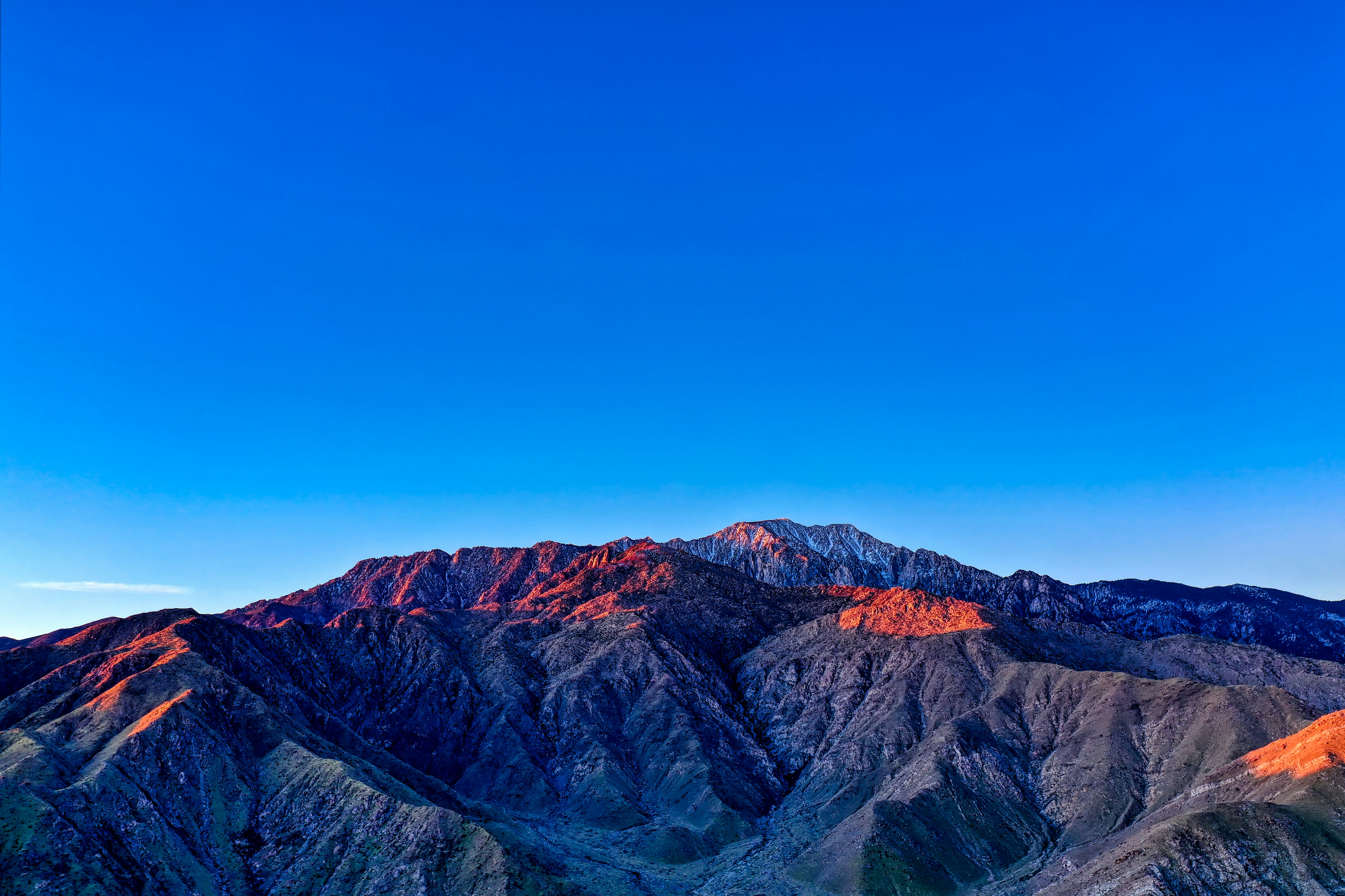 brown rocky mountain under blue sky during daytime